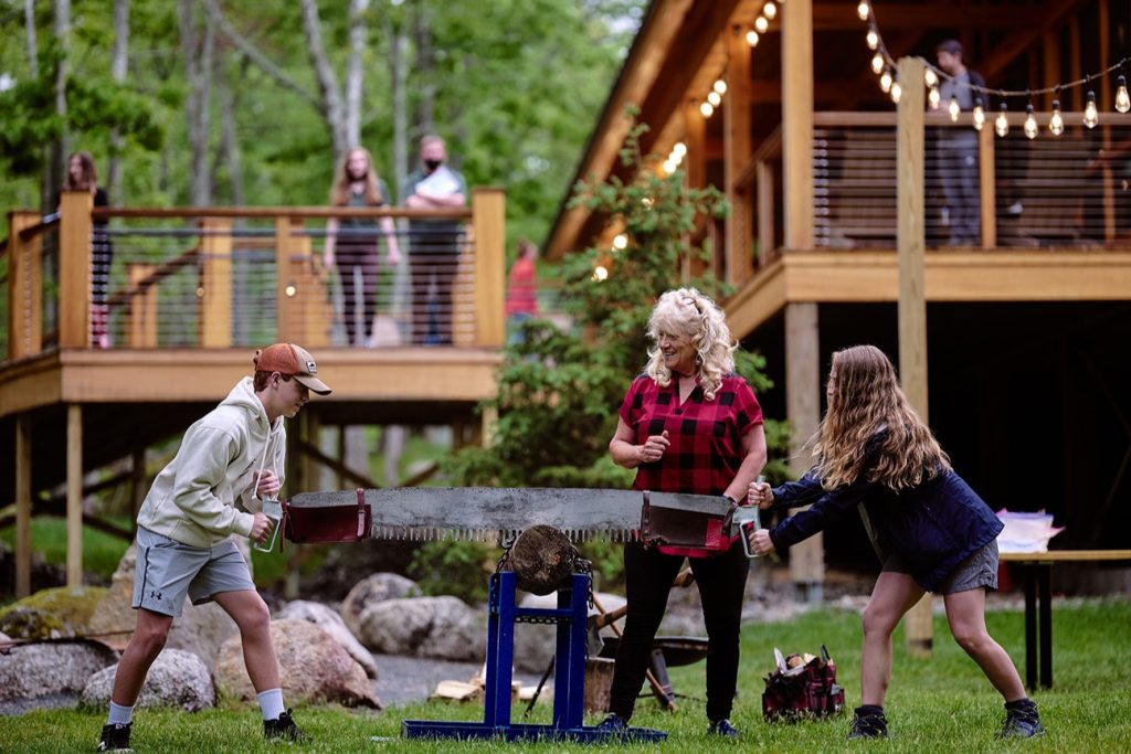 sawing wood outdoors 