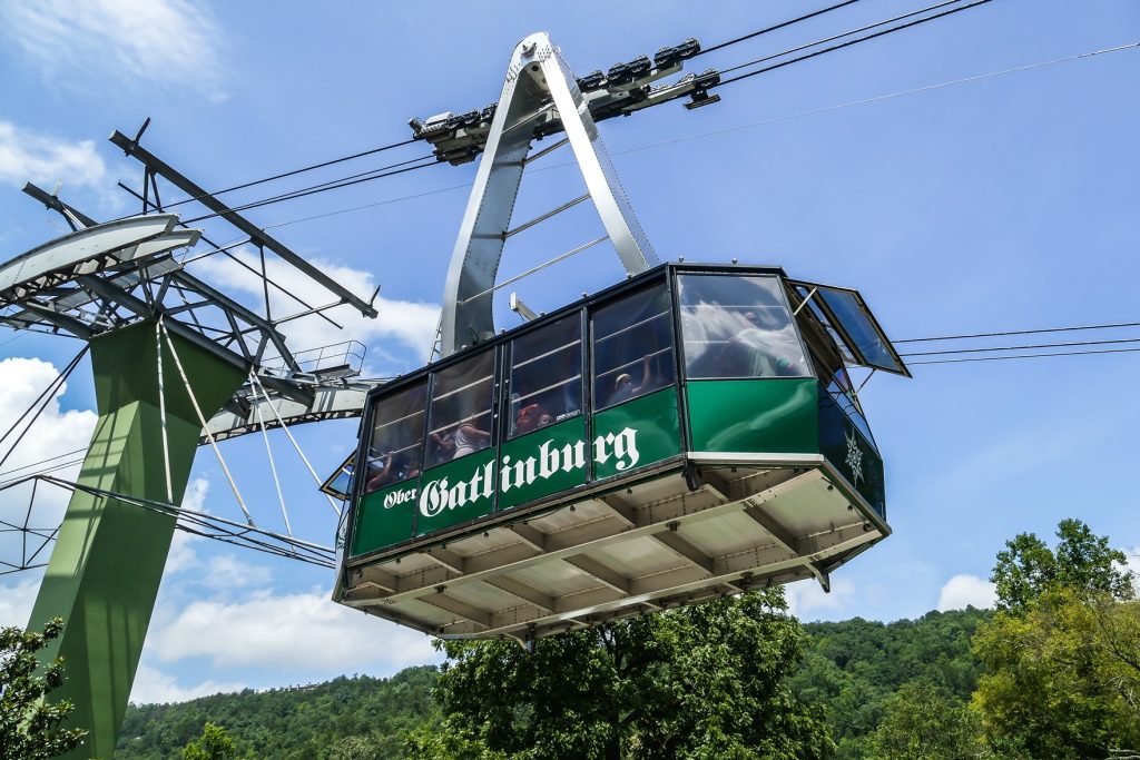 busy families take gondola for convenience for day trips, national park